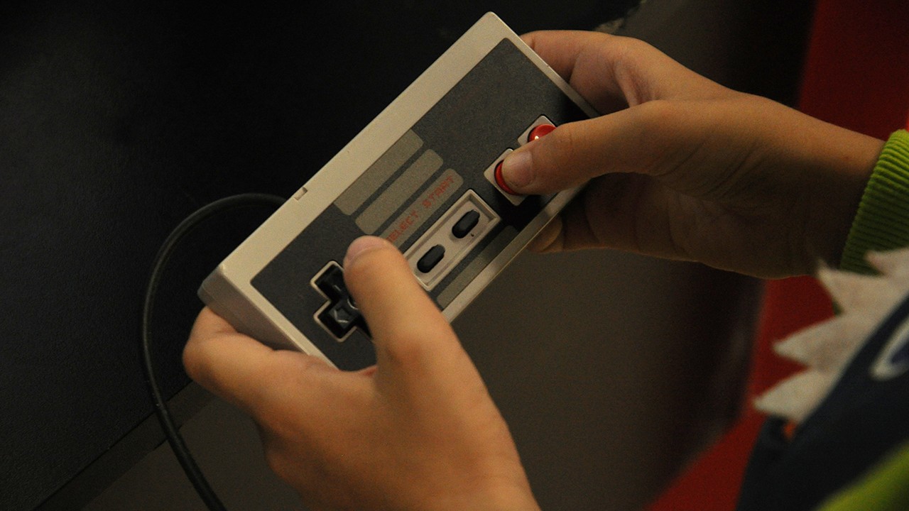Kid playing the Nintendo Entertainment System